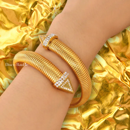 Gold plated twist bangle with zircons